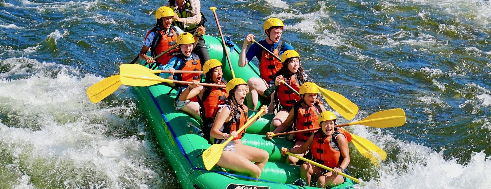 Campers rafting white water