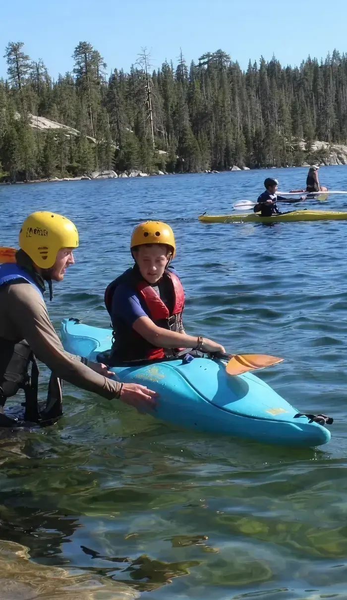 Campers kayaking on the lake